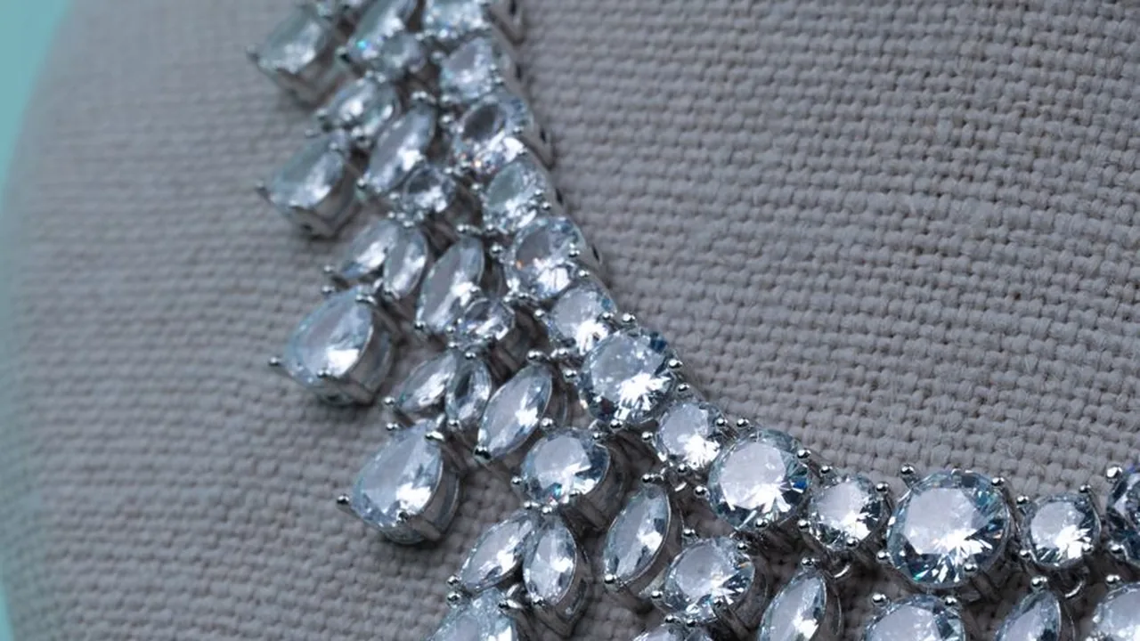 A silver multi-strand jewellery set with its earrings
